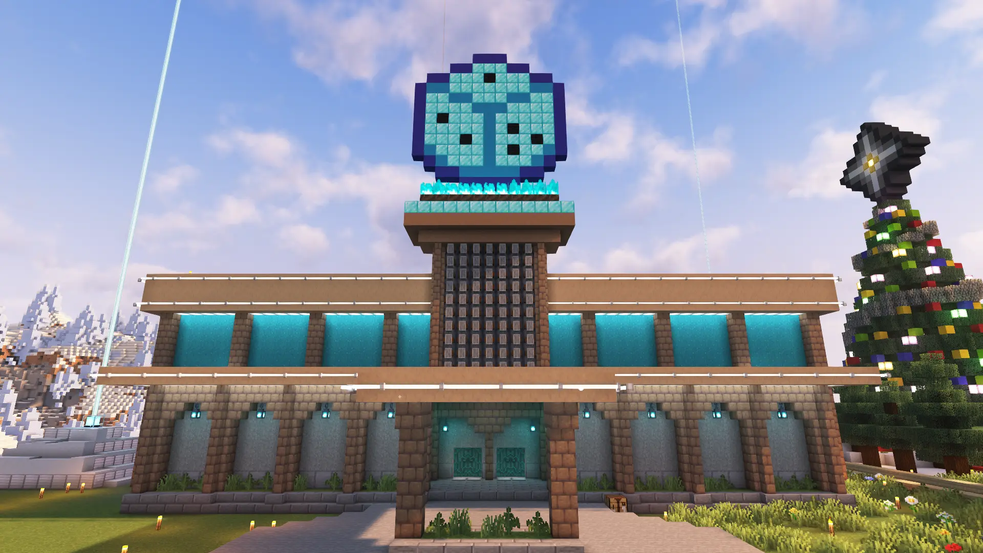 A two story building with grey walls on the first floor and blue walls on the second, with brown mud bricks for the accents. At the top of the building is a sign that shows a large dice built out of diamond blocks.